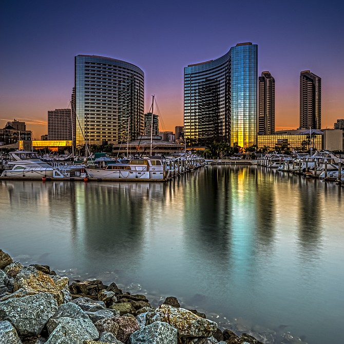 Cloudless sunset to my back reflecting off the mirrored buildings 
🔸San Diego Marriott Marquis & Marina 🔸Shot from the Embarcadero Marina Park North
🔹5 shot HDR, photo realistic 🔹ND4 & ND8 Gradient Filters 