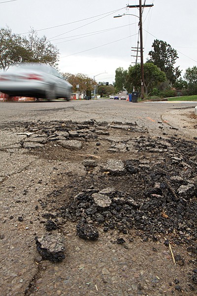 Potholes begin with a crack (First Avenue, west Chula Vista)