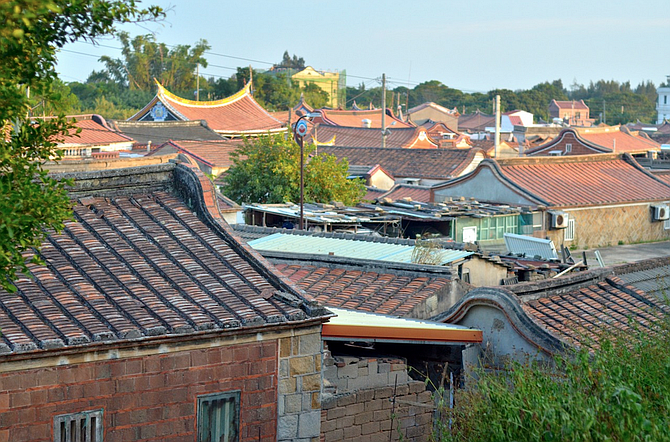Village rooftops from a hill. 