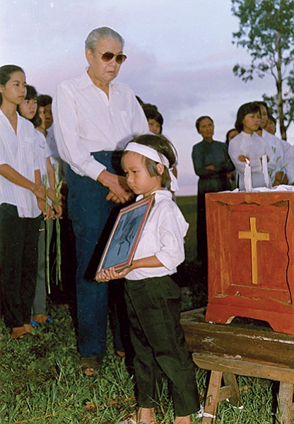Tam at his brother’s funeral