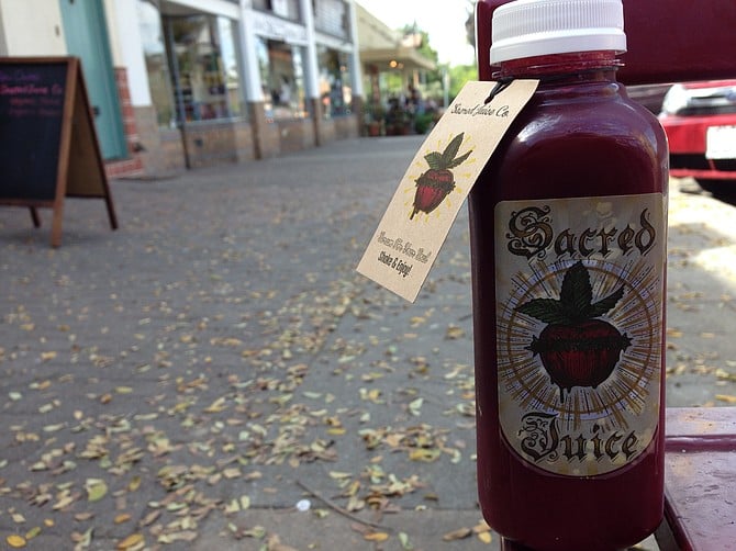 Cold press juice hits South Park. Queen Beet. Sacred Juice Co.