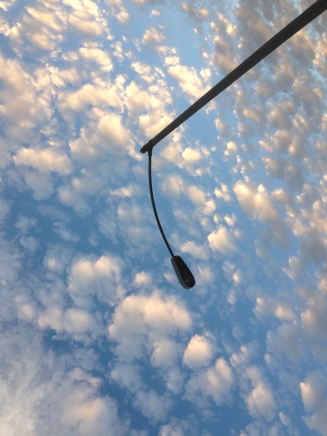 Nice group of cumulus clouds over a light pole near my home in Rancho Penasquitos.  iPhone photo.  January 2015. 