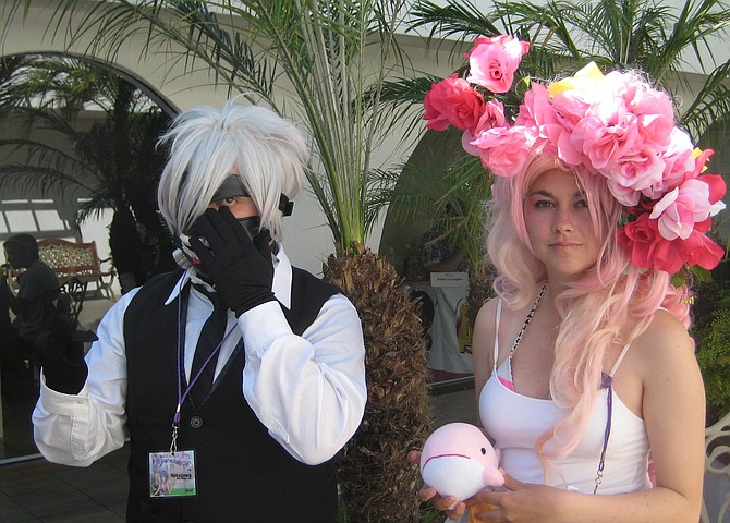 They are potraying Ken Kaneki (character from Tokyo Ghoul) and Rose Quartz (character from Steven Universe).