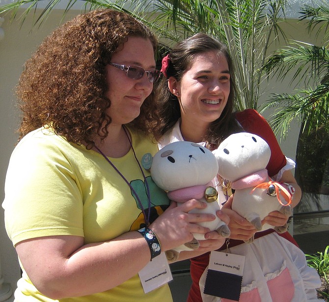These 2 women are holding Bee and Puppycat 
