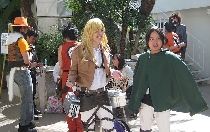 Historia Reiss/Krista Lenz character from Attack on Titan in the middle and Dragon Ball Z character on the far right