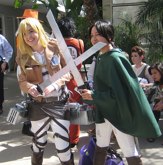 Historia Reiss/Krista Lenz character from Attack on Titan on the left
