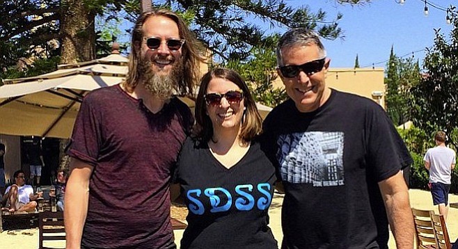 Juli Goldenberg, flanked by Stone co-founders Greg Koch (left) and Steve Wagner