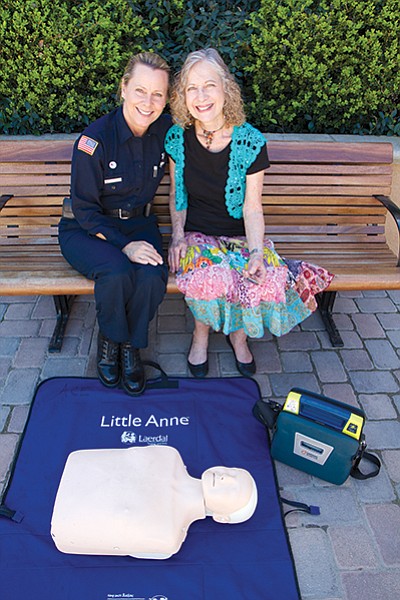 Maureen O’Connor (on left) of Project Heartbeat with defibrillator donor Bobbie Cohen