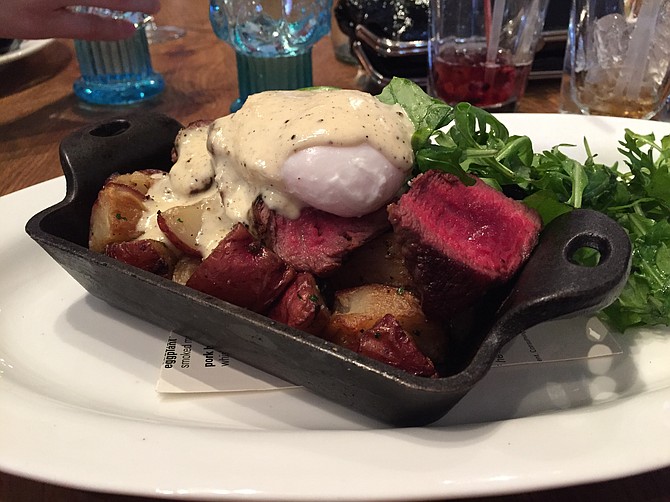 Cowboy Steak with eggs, potatoes, and horseradish-black pepper hollandaise