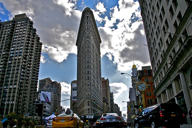 The Flatiron building at 23rd Street and Broadway in NYC.  Formerly the Fuller Building, the 87 meter high structure is the original New York skyscraper.