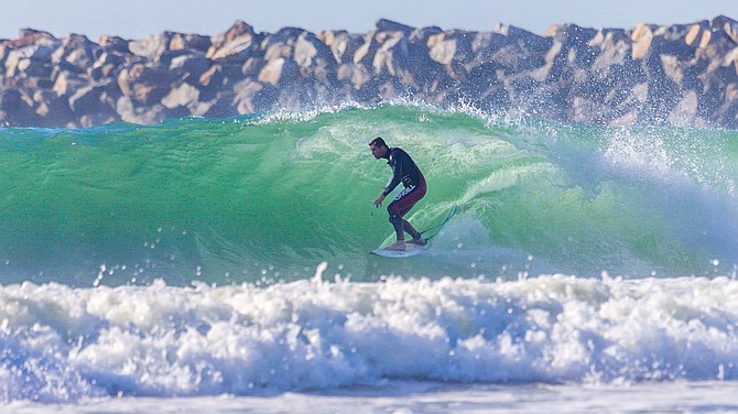 Kyle Knox surfing at the Dog Beach Jetty in OB