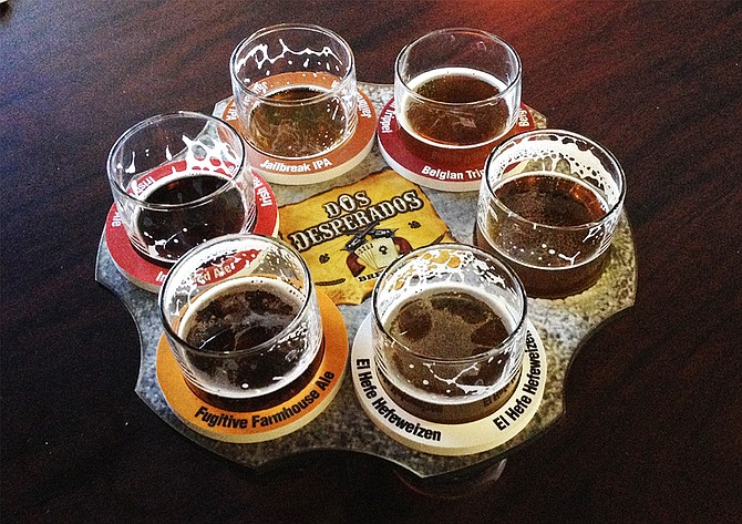 A six-shooter of beers at Dos Desperados Brewery in San Marcos (photo by @sdbeernews)