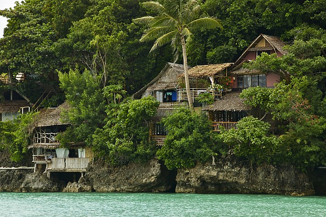 Nipa houses overlooking the Sibuyan Sea on the island of Boracay in the Philippines.