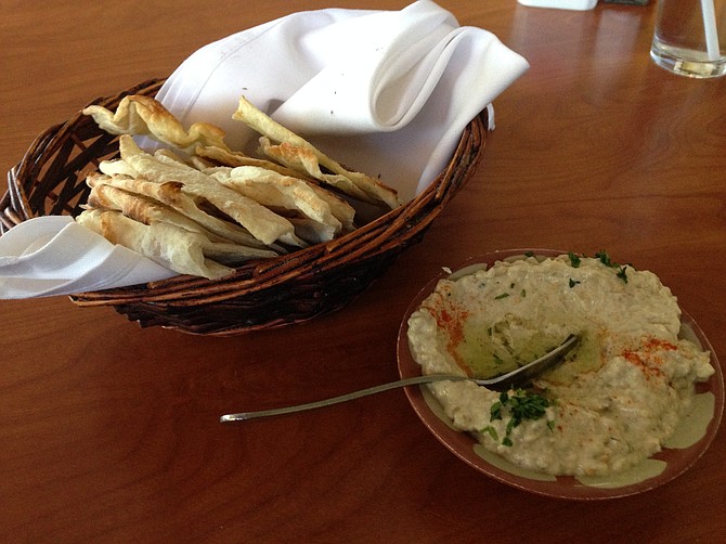 Baba ghanoush and a basket of fresh flat bread