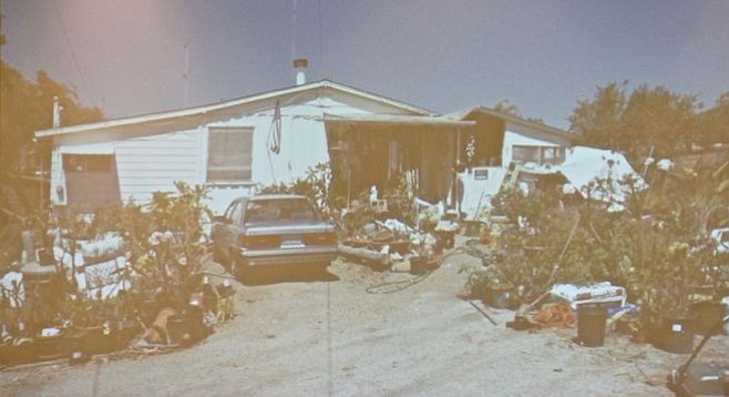 Robinson lived in a humble home with his mother, across the street from the neighbor boy. Evidence photo
