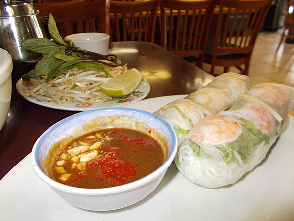 Chili-peanut sauce and spring rolls stuffed with shrimp, pork, bean sprouts, mint, lettuce, and chives. 