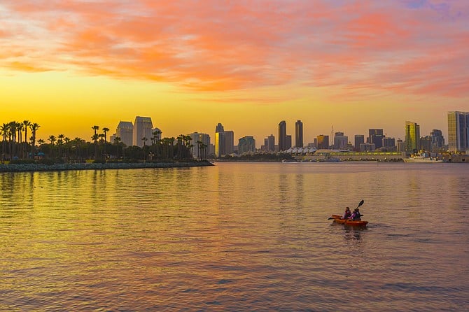 Adventurers paddling across Glorietta Bay during civil twilight.