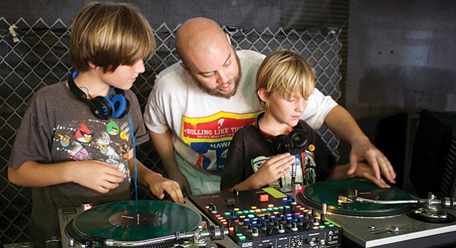 Vinyl Junkies get kids hooked on records by setting them up behind the decks.