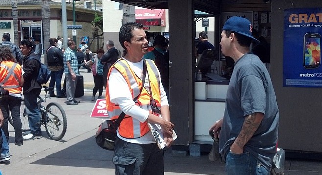 Pedro Rios fields a complaint from a man emerging from the northbound San Ysidro border crossing