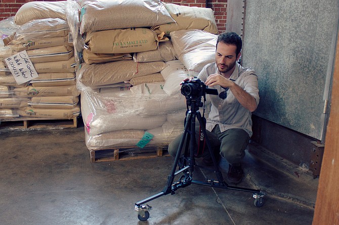 Cinematographer Steven Moyer sets up a shot surrounded by craft beer ingredients.