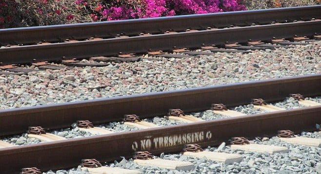 More visible signs won't deter those who are going to cross the railroad tracks!