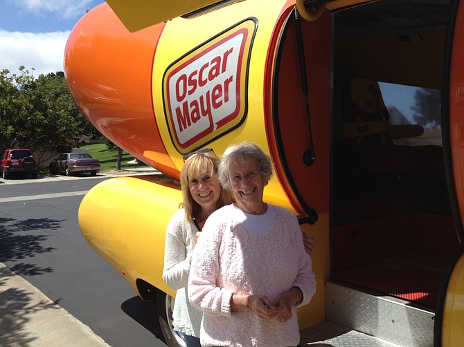 Edith Alter of Encinitas gets a surprise ride in the Wienermobile, arranged by her daughter Lois Alter Mark.
