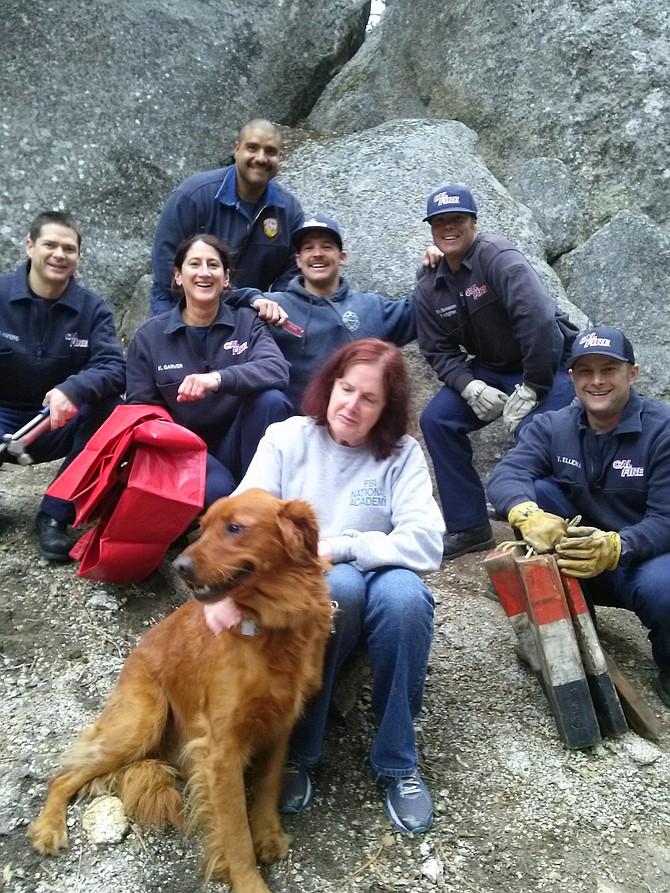 Cal Fire rescue crew and Sara Norris with Aslan