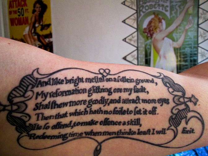 These are the last six lines from Prince Henry's soliloquy in Act I, scene II of Shakespeare's Henry IV pt. 1. I would have gotten the whole thing tattooed on me but my arm's not that big. See, Hal's in a bit of a bind because he's due to be King soon enough but the company and habits he keeps are rather unsavory. This leads the public to form a similarly unsavory opinion of the Prince, and they're not too keen on the idea of having him for a leader. No one expected him to ever change his stars, but Hal remained convinced of his own potential to shine. He knew, if no one else did, that one day he would become a great and noble king, and also he knew that all of the naysayers would have hats to eat on that day. Spite drove him to rise from the bottom, and when he made it, honor kept him at the top. 

The typeface, spelling, and flourish design surrounding the tattoo are all taken from the plays 'First Quarto' printing in 1598. I got it from an amazing tattooist named Danielle in Oakland. I'm a 30 year old poet who lives in Golden Hill.