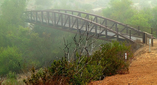 An iron bridge spans Del Dios Gorge.