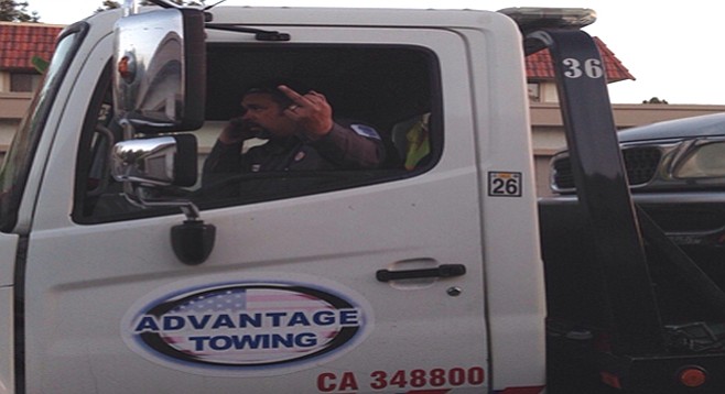 Tow-truck driver salutes a passerby