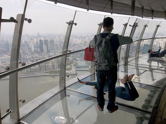 Having fun with the transparent floor at the Oriental Pearl Tower observation deck, Shanghai