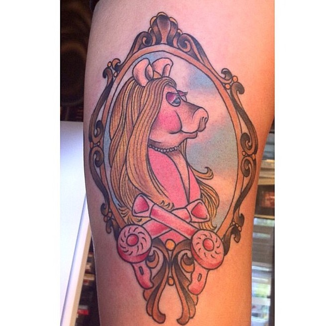 I got this gorgeous Miss Piggy tattoo because A) I LOVE The Muppets and B) I'm a feminist. What's more feminist than an unapologetic diva pig wearing a pearl necklace?! Justin at Red Crow did this on me. I'm a 24 year old AV technician working at a hotel downtown, living in Clairemont. I've gotten a lot of compliments on her. She's my favorite tattoo!