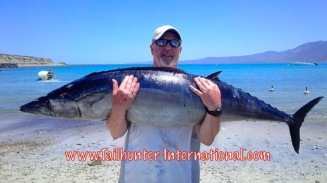 Tim McCrink and a fat wahoo caught near La Paz.