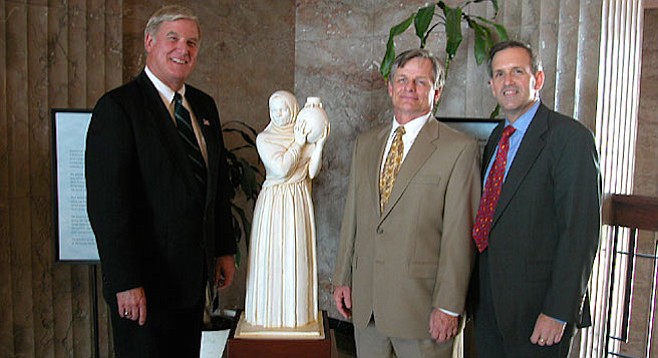 County supervisor Greg Cox, clerk Thomas Pastuszka, and John Wadas, executive director of the San Diego Historical Society flank a Donal Hord sculpture (Guardian of the Water) March 12, 2003.