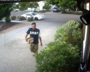 Police released this photo of a suspect who stole a package from a home in the Clairemont area on May 18. He drove off in the white vehicle shown in the photo. 