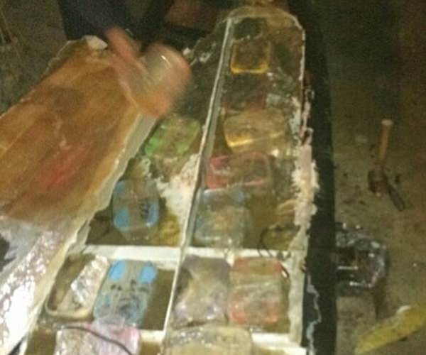 Packs of meth and batteries were under the top layer of fiberglass.