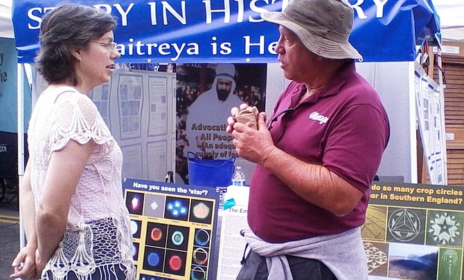 Welcome, Space Brothers, to our Chili Cook-Off

Shelli Craig of Share International talks to an attendee of the Ocean Beach Street Fair and Chili Cook-Off on Saturday, June 27. According to information online, Share International is devoted to "Maitreya, The Masters of Wisdom, and our Space Brothers."