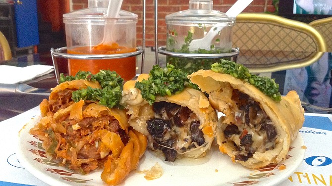 Lengua and portobello empanadas covered in chimichurri