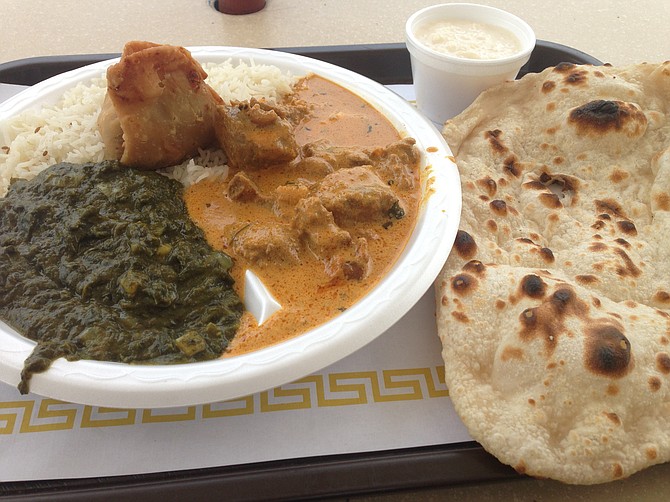 One vegetable samosa plus rice, raita, naan, lamb curry, and that old spinach standby, saag