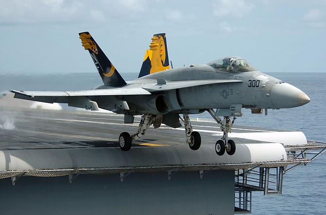 An F/A-18C Hornet launching from an aircraft carrier