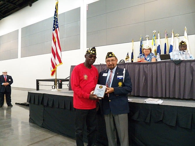 Joe Rush, at left, Commander of The American Legion’s Dennis T. Williams Post 310, located at 465 N. 47th Street, shown here in Ontario, California, at the annual Department of California Convention on Friday, June 26. Rush accepted statewide recognition for “Most Unique Project” of community service from fellow Legionnaire Michael Stadnick, of Santa Maria. The award was bestowed for Commander Rush’s and Post 310 Legionnaires’ seven-year efforts, which led to the June 3 renaming of the Chollas View Street formerly called Lise Avenue to Lakiba Palmer Avenue, honoring the memory and sacrifice of Lakiba Nicole Palmer, a U.S. Navy seaman among those killed in the terrorist bombing of the USS Cole in October 2000. Palmer had lived on Lise Avenue while growing up in the neighborhood.