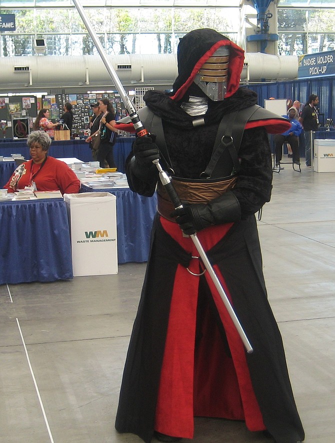 cosplayer in front of freebie table