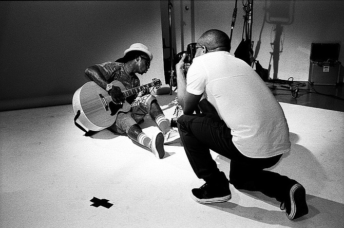 Eric Johnson taking photos of Lil Wayne