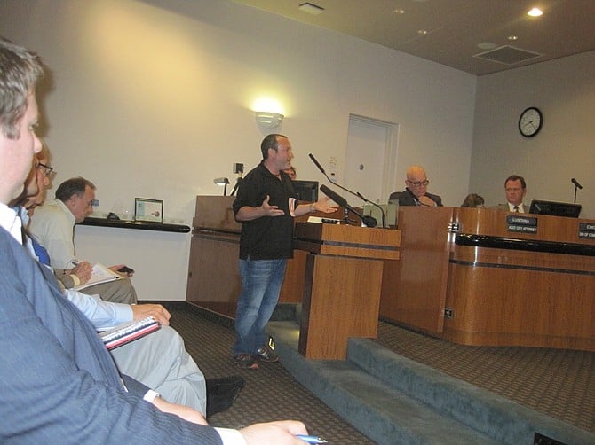 Aaron Amerling testifies at May 20 hearing; Bill Chopyk is on the far right on the dais.