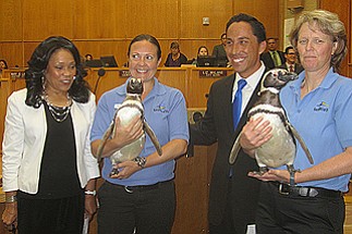 Gloria poses with SeaWorld employees