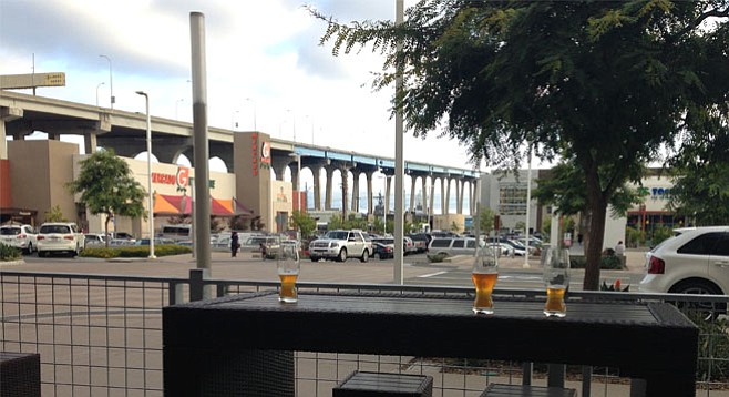 Drinking beers with a view of the Coronado bridge — happening now at Iron Fist's Barrio Logan tasting room.