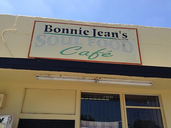 Sun-faded sign above Bonnie Jean's