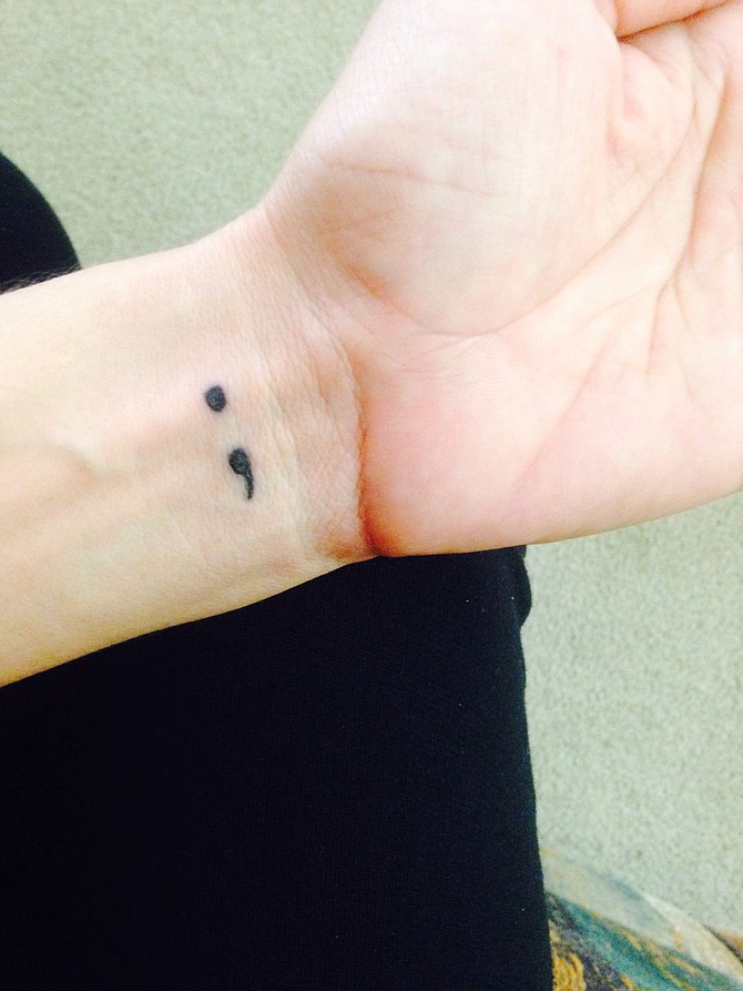 I got my newest tattoo on my wrist. It's a semicolon. The reason why I got is to remind me every time I look at it, that my life isn't over yet. It's part of the semicolon project. It means a sentence that could of been ended by the author but chose not to. My name is Morenita and work in the Medical field in San Diego. 