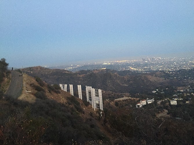 Like the moon rising on the horizon, the Hollywood Sign.