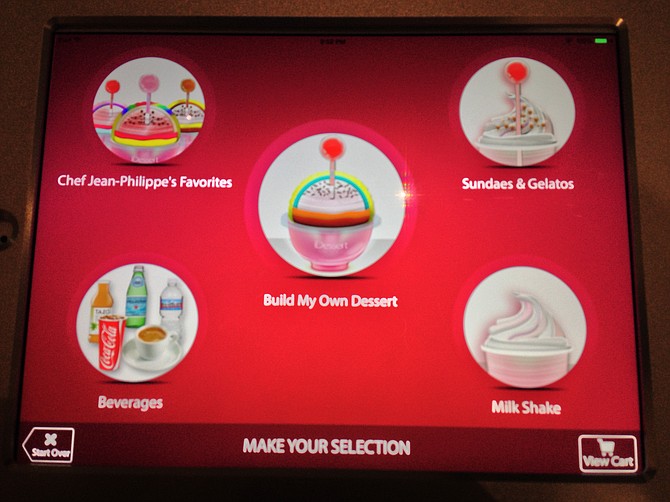iPads give you a chance to mull over your custom dessert recipe.